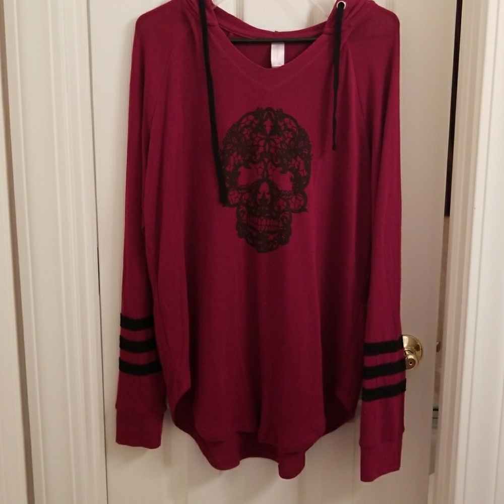 Burgundy shirt with intricate black skull and hood